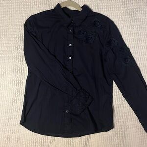 Chicos black button blouse with floral details.
